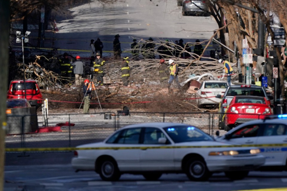 <strong>Investigators continue to examine the site of an explosion Sunday, Dec. 27, 2020, in downtown Nashville where an explosion shook the area early Christmas morning.</strong> (Mark Humphrey/AP)