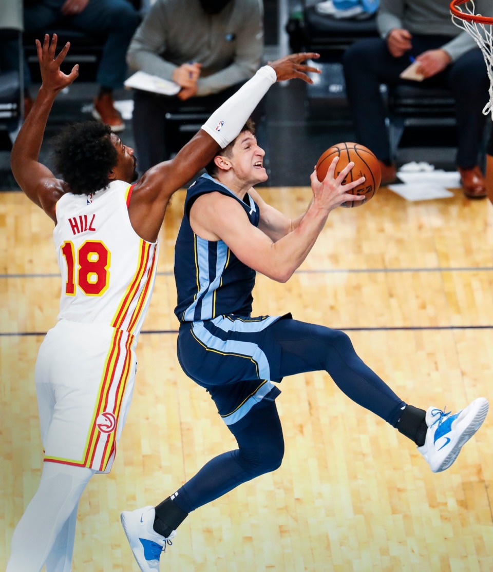 <strong>Memphis Grizzlies guard Grayson Allen (right) is fouled by Atlanta Hawks defender Solomon Hill (left) during action on Saturday, Dec. 26, 2020.</strong> (Mark Weber/The Daily Memphian)