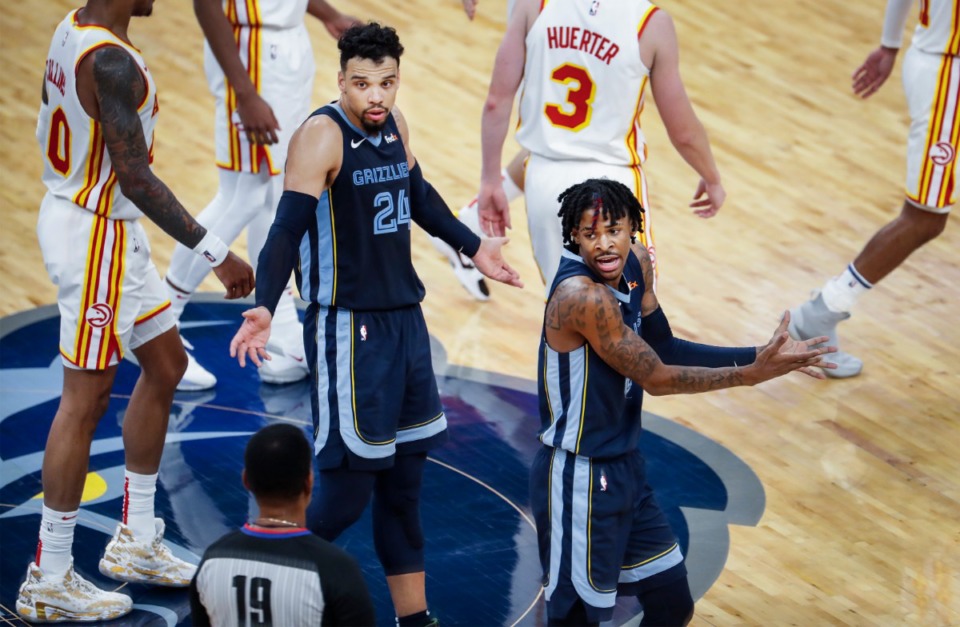 <strong>Memphis Grizzlies guard Ja Morant (right) reacts after being called for a technical foul as teammate Dillon Brooks (middle) looks on during the final minutes of action against the Atlanta Hawks on Saturday, Dec. 26, 2020.</strong> (Mark Weber/The Daily Memphian)