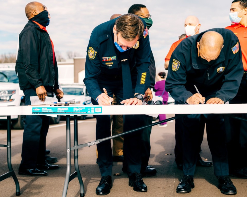 <strong>Members of the Memphis Police Department fill out forms before getting the coronavirus vaccine on Monday, Dec. 28.</strong> (Houston Cofield/Special to the Daily Memphian)