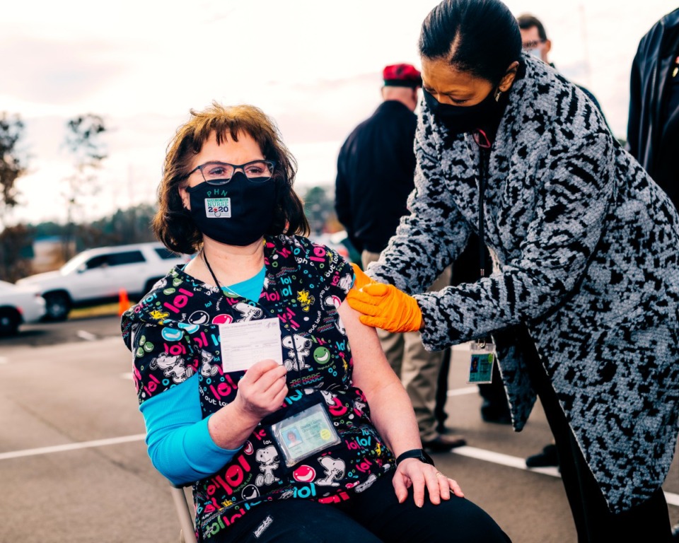 <strong>Janice Stahl, a registered nurse for more than 35 years, was the first in a long line of health care and essential workers to receive the coronavirus vaccine on Monday, Dec. 28.</strong> (Houston Cofield/Special to the Daily Memphian)
