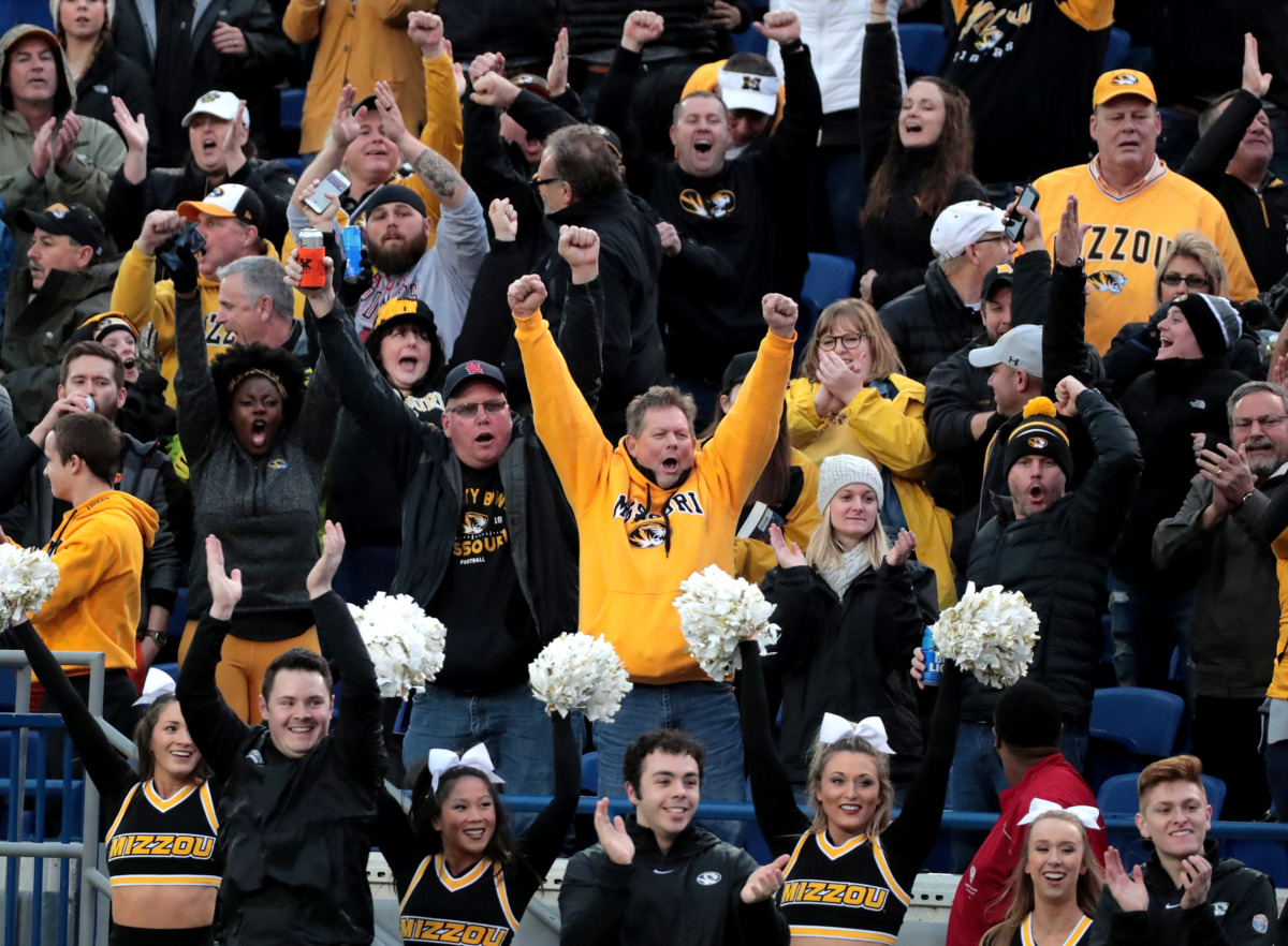 <strong>Missouri fans celebrate after the Tigers score a touchdown against Oklahoma State in the AutoZone Liberty Bowl on Dec. 31, 2018. Mizzou went into halftime leading 16-14 but ultimately fell to the Cowboys 38-33.</strong> (Houston Cofield/Daily Memphian)