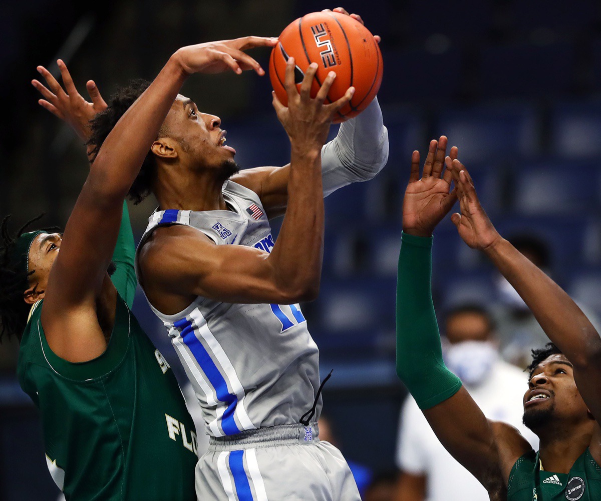 <strong>University of Memphis forward Deandre Williams (12) drives to the basket during a home game against the University of South Florida on Dec. 29, 2020.</strong> (Patrick Lantrip/Daily Memphian)