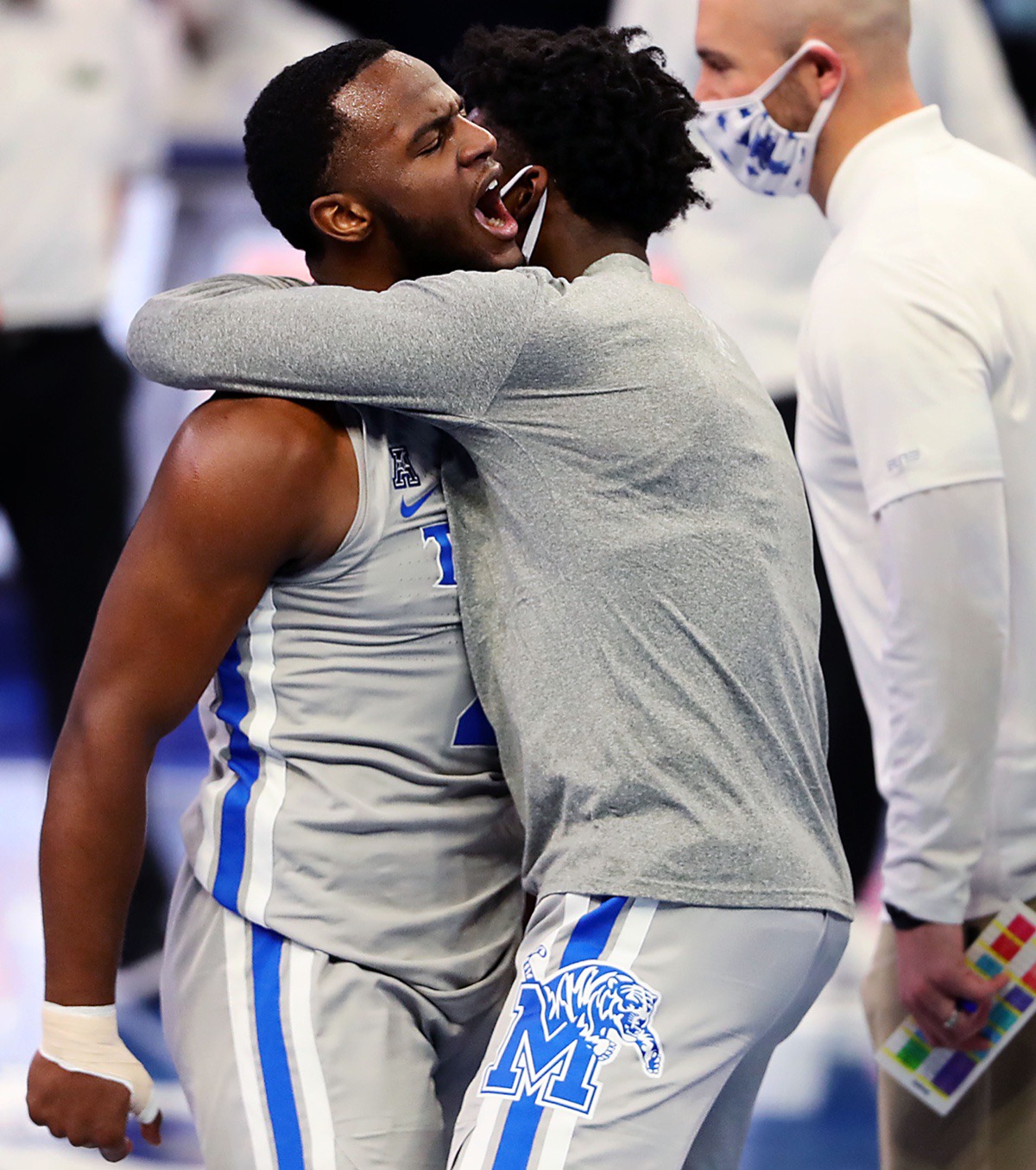 <strong>University of Memphis guard Alex Lomax (2) celebrates with teammates after making a game-saving stop during a home game against the University of South Florida on Dec. 29, 2020.</strong> (Patrick Lantrip/Daily Memphian)
