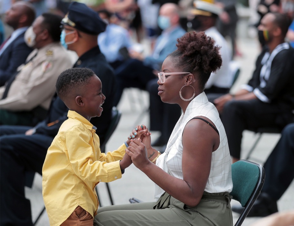 <strong>Shelby County chief of staff Danielle Inez sings "Lean of Me" with her five-year-old son Joseph during a memorial service held for George Floyd at Civic Center Plaza in Downtown Memphis June 8, 2020</strong>. (Patrick Lantrip/Daily Memphian)
