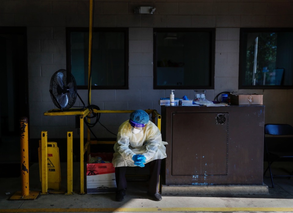 <strong>A Christ Community Health Services staff member waits for patients at a drive-thru coronavirus testing site on Wednesday, October 20, 2020 on Lamar Avenue</strong>. (Mark Weber/The Daily Memphian)