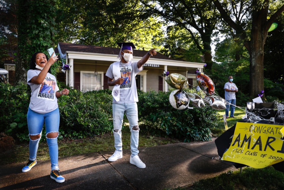 <strong>Amari Ajamu (middle), along with sister Nzinga Ajamu (left), celebrates his Stax Music Academy graduation with a car parade from family and friends on Monday, May 18, 2020</strong>. (Mark Weber/Daily Memphian)