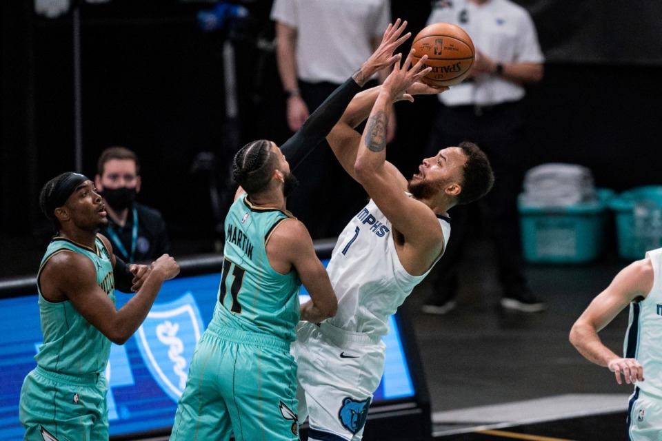 <strong>Memphis Grizzlies forward Kyle Anderson (1) shoots over Charlotte Hornets forward Cody Martin (11) during the first half of an NBA basketball game in Charlotte, N.C., Friday, Jan. 1, 2021.</strong> (AP Photo/Jacob Kupferman)