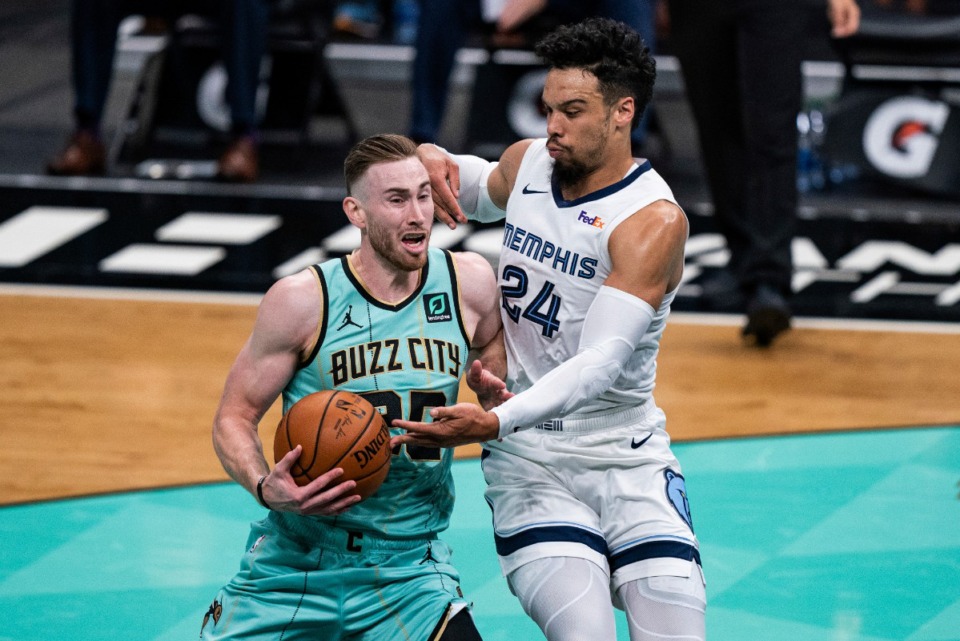 <strong>Memphis Grizzlies guard Dillon Brooks (24) defends against Charlotte Hornets forward Gordon Hayward (20) during the first half of an NBA basketball game in Charlotte, N.C., Friday, Jan. 1, 2021.</strong> (AP Photo/Jacob Kupferman)