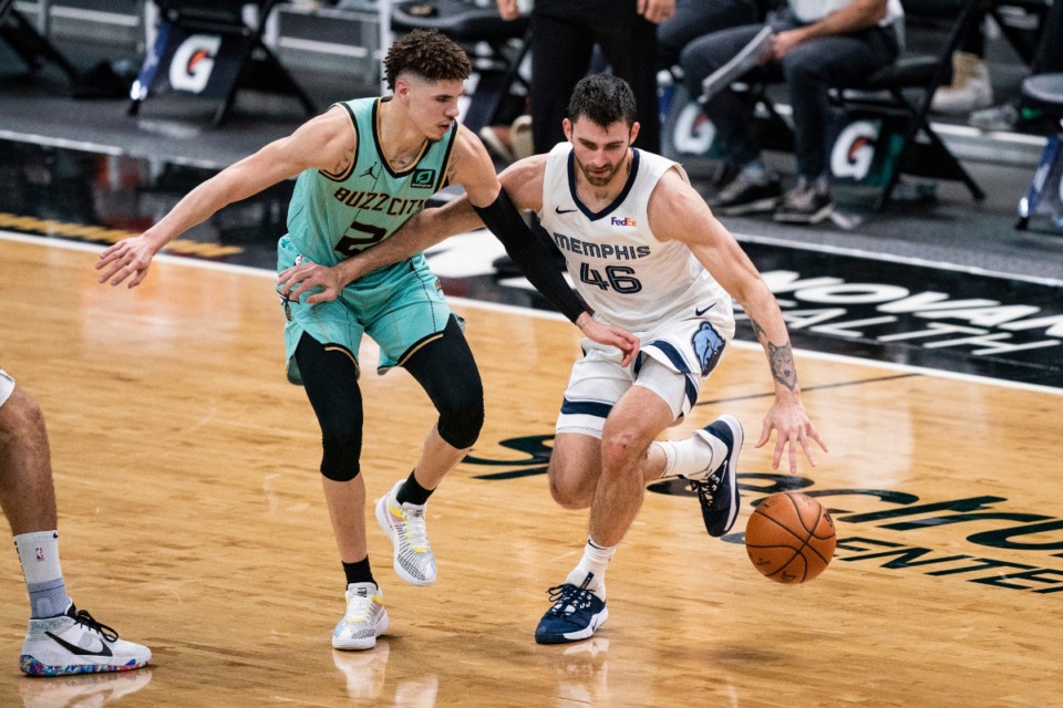 <strong>Charlotte Hornets guard LaMelo Ball (2) defends against Memphis Grizzlies guard John Konchar (46) during the first half of an NBA basketball game in Charlotte, N.C., Friday, Jan. 1, 2021.</strong> (AP Photo/Jacob Kupferman)