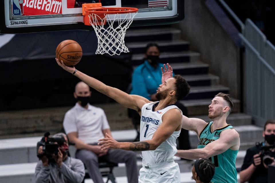 <strong>Memphis Grizzlies forward Kyle Anderson (1) lays up the ball past Charlotte Hornets forward Gordon Hayward during the first half of an NBA basketball game in Charlotte, N.C., Friday, Jan. 1, 2021.</strong> (AP Photo/Jacob Kupferman)