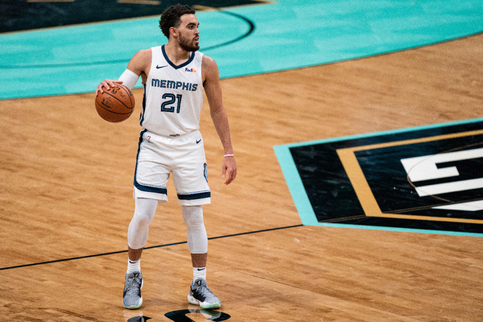 <strong>Memphis Grizzlies guard Tyus Jones (21) brings the ball up court against the Charlotte Hornets during an NBA basketball game in Charlotte, N.C., Friday, Jan. 1, 2021.</strong> (Jacob Kupferman/AP)