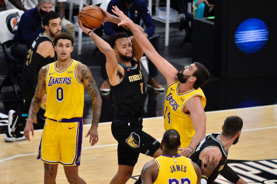 <strong>Memphis Grizzlies forward Kyle Anderson (1) tries to pass over Los Angeles Lakers center, and former Grizzly, Marc Gasol (14) on Tuesday, Jan. 5, 2021, at FedExForum.</strong> (Brandon Dill/AP)