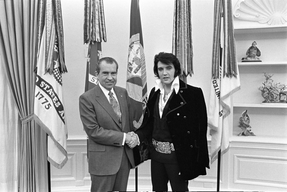 <strong>On Dec. 21, 1970, Elvis Presley showed up unannounced at the White House gates to deliver a letter to President Richard Nixon.&nbsp;This picture of the meeting is the most requested photo from the National Archives.</strong> (Courtesy of National Archives)