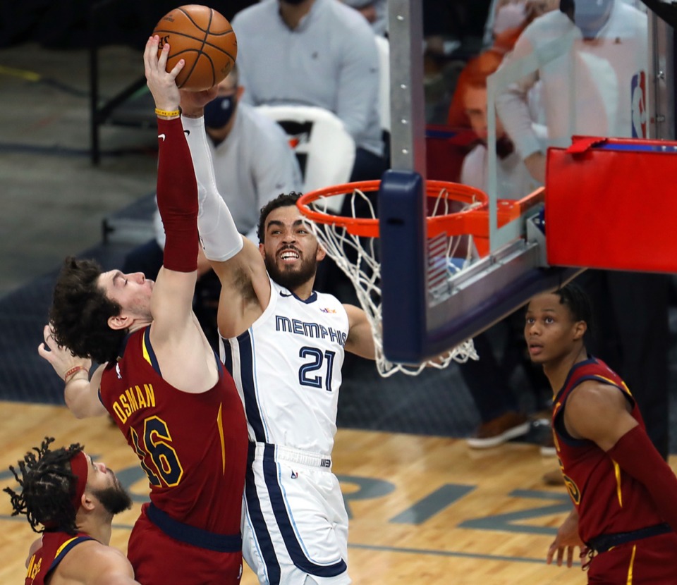 <strong>The Grizzlies&rsquo; Tyus Jones (21) tries to shoot over Cleveland&rsquo;s Cedi Osman (16) on Jan. 7, 2021, at FedExForum.</strong> (Patrick Lantrip/Daily Memphain)