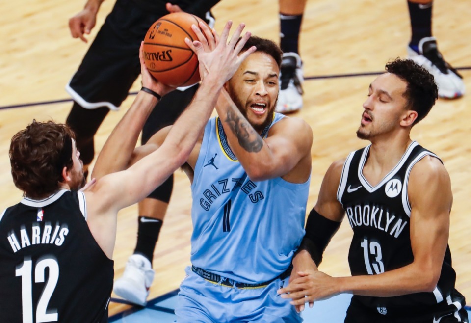 <strong>Grizzlies forward Kyle Anderson (middle) drives the lane against Brooklyn&rsquo;s Joe Harris (left) and Landry Shamet (right) on Friday, Jan. 8, 2021.</strong> (Mark Weber/The Daily Memphian)