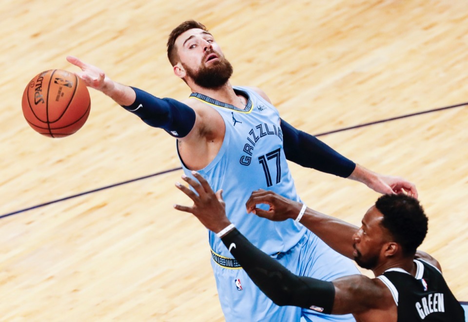 <strong>Grizzlies center Jonas Valanciunas (top) fights for&nbsp;a rebound against Brooklyn&rsquo;s Jeff Green (bottom) on Friday, Jan. 8, 2021.</strong> (Mark Weber/The Daily Memphian)