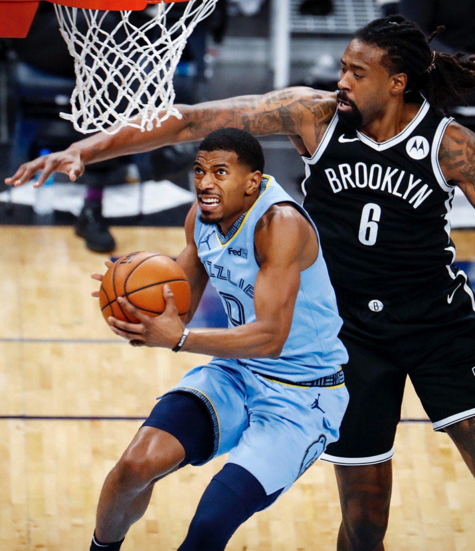 <strong>Memphis Grizzlies guard De'Anthony Melton (left) drives for a layup in front of Brooklyn&rsquo;s DeAndre Jordan (right) on Friday, Jan. 8, 2021.</strong> (Mark Weber/The Daily Memphian)