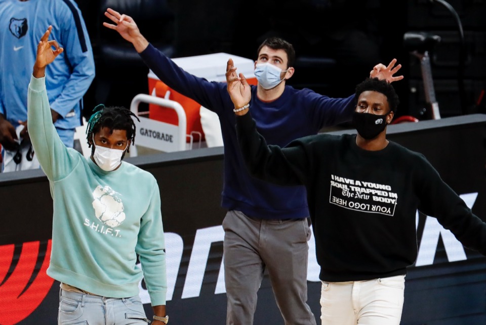 <strong>Grizzlies teammates Justise Winslow, (left) John Konchar (middle) and Jaren Jackson Jr. (right) celebrate during the game against the Brooklyn Nets on Friday, Jan. 8, 2021.</strong> (Mark Weber/The Daily Memphian)
