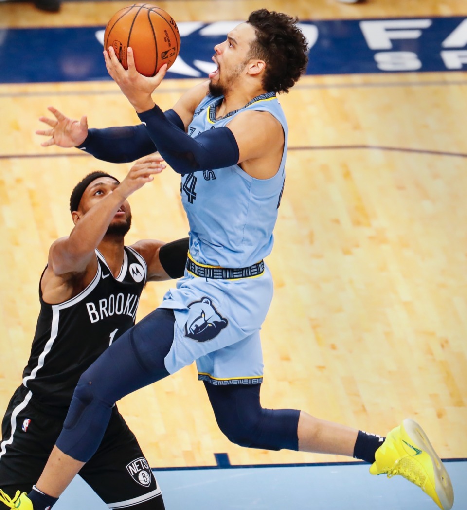 <strong>Grizzlies guard Dillion Brooks (right) lays in two against Brooklyn&rsquo;s Bruce Brown (left) on Friday, Jan. 8, 2021.</strong> (Mark Weber/The Daily Memphian)