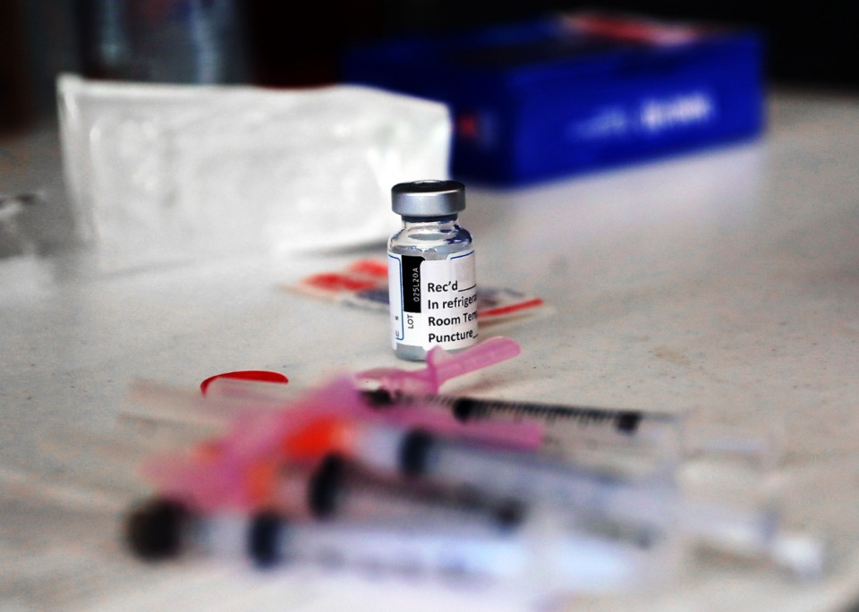 <strong>A vial of COVID-19 vaccine sits near a handful of syringes at the Shelby County Health Department's first responder vaccination site Jan. 3, 2020.</strong> (Patrick Lantrip/Daily Memphian)