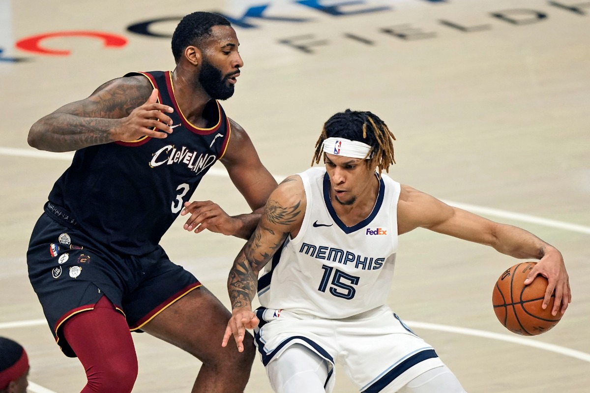 <strong>The Grizzlies' Brandon Clarke (15) drives past Cleveland&rsquo;s Andre Drummond (3) on Monday, Jan. 11, 2021, in Cleveland.</strong> (Tony Dejak/AP)