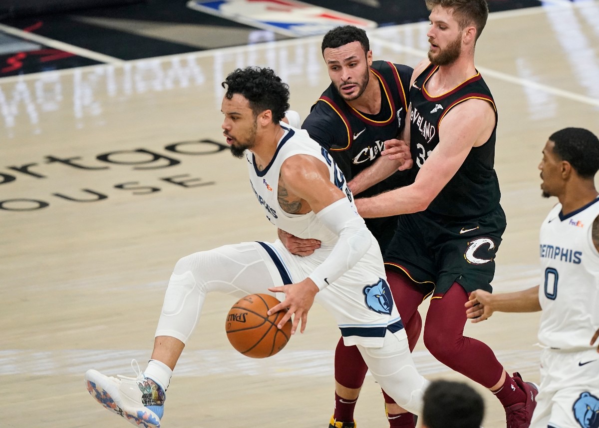 <strong>Memphis Grizzlies' Dillon Brooks, left, is fouled by Cleveland&rsquo;s Larry Nance Jr., second from left, on Jan. 11, 2021, in Cleveland. Cavaliers' Dean Wade, second from right, and Grizzlies' De'Anthony Melton, right, watch.</strong> (Tony Dejak/AP)