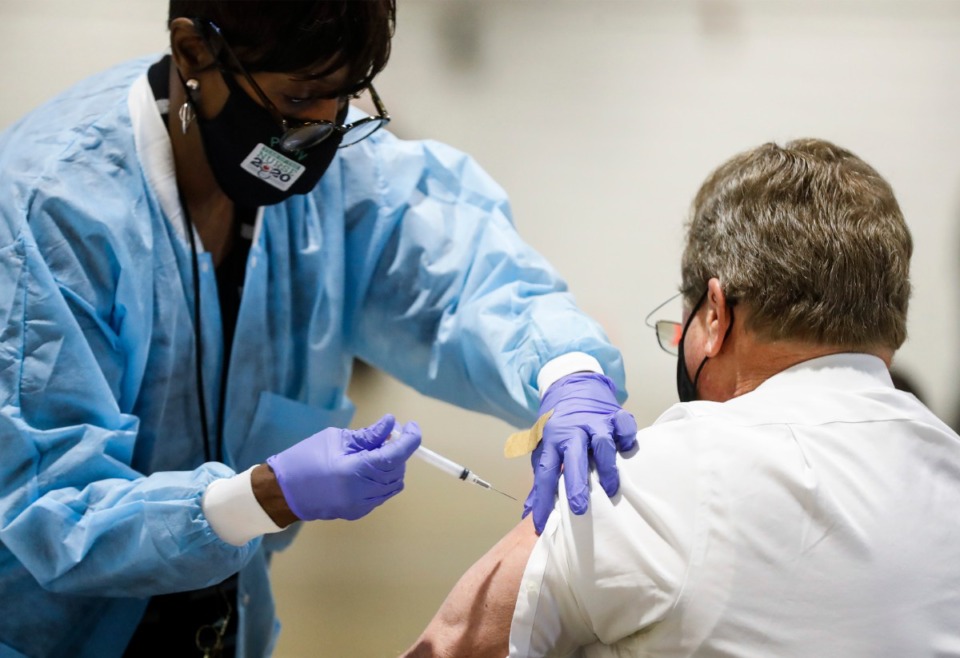 <strong>Shelby County Health Department personnel and volunteers administer COVID-19 vaccinations on Tuesday, January 12, 2021 in the Pipkin Building at Tiger Lane</strong>. (Mark Weber/The Daily Memphian)