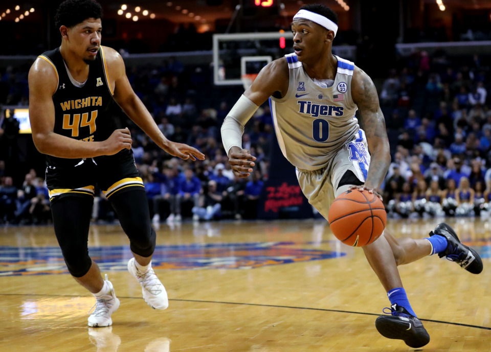 <strong>University of Memphis Tigers forward Kyvon Davenport (0) drives toward the basket against Wichita State forward Isaiah Chandler (44) during a game against the Shockers on Thursday, Jan. 3, 2019. The Tigers beat the Shockers 85-74.</strong> (Houston Cofield/Daily Memphian)