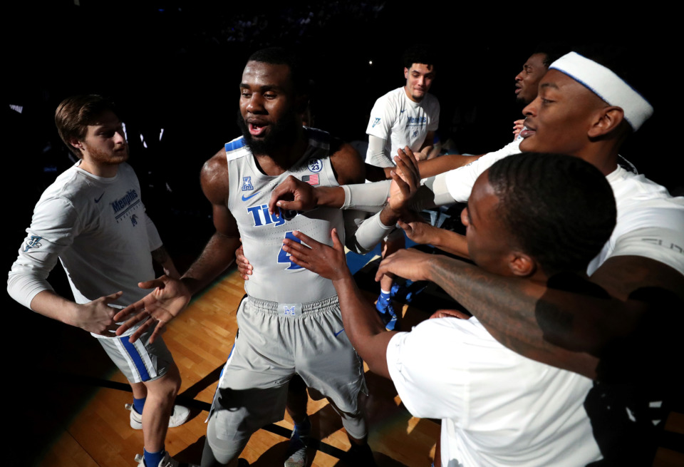 <strong>University of Memphis Tigers forward Raynere Thornton (4) runs through a tunnel of players prior to the start of the game against the Witchita State Shockers on Thursday, Jan. 3, 2018. The Tigers beat the Shockers 85-74.</strong> (Houston Cofield/Daily Memphian)