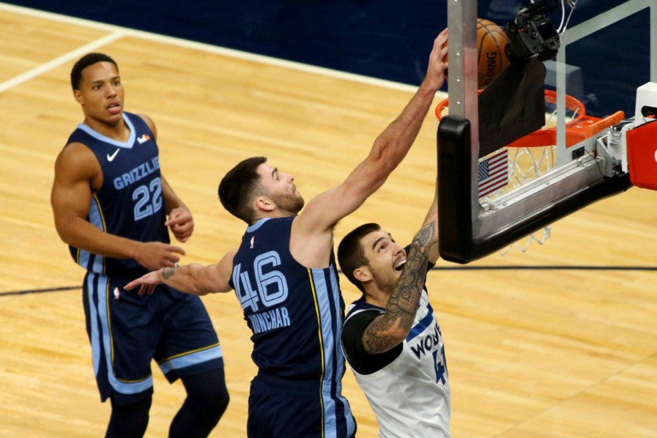 <strong>Minnesota Timberwolves forward Juancho Hernangomez (41) has a shot blocked by Memphis Grizzlies guard John Konchar (46) with Grizzlies guard looking on in the first quarter during an NBA preseason basketball game, Saturday, Dec. 12, 2020, in Minneapolis.</strong> (Andy Clayton-King/AP)