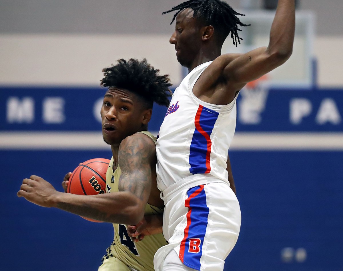 <strong>Arlington High School guard Madison Peaster (4) tries to get past Bartlett High School guard Amarr Knox (1) on Jan. 15, 2021.</strong> (Patrick Lantrip/Daily Memphian)