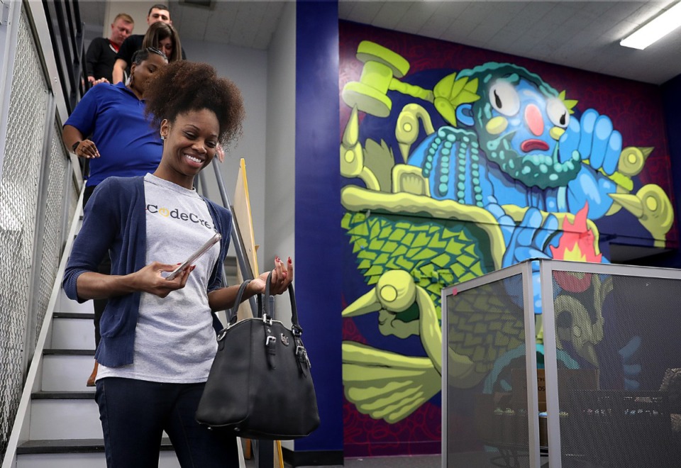 <strong>Erin Johnson, program director at CodeCrew Code School (in a 2019 file photo) tours the old Highland Branch Library, which was converted into a research incubator for the University of Memphis.</strong> (Patrick Lantrip/Daily Memphian)