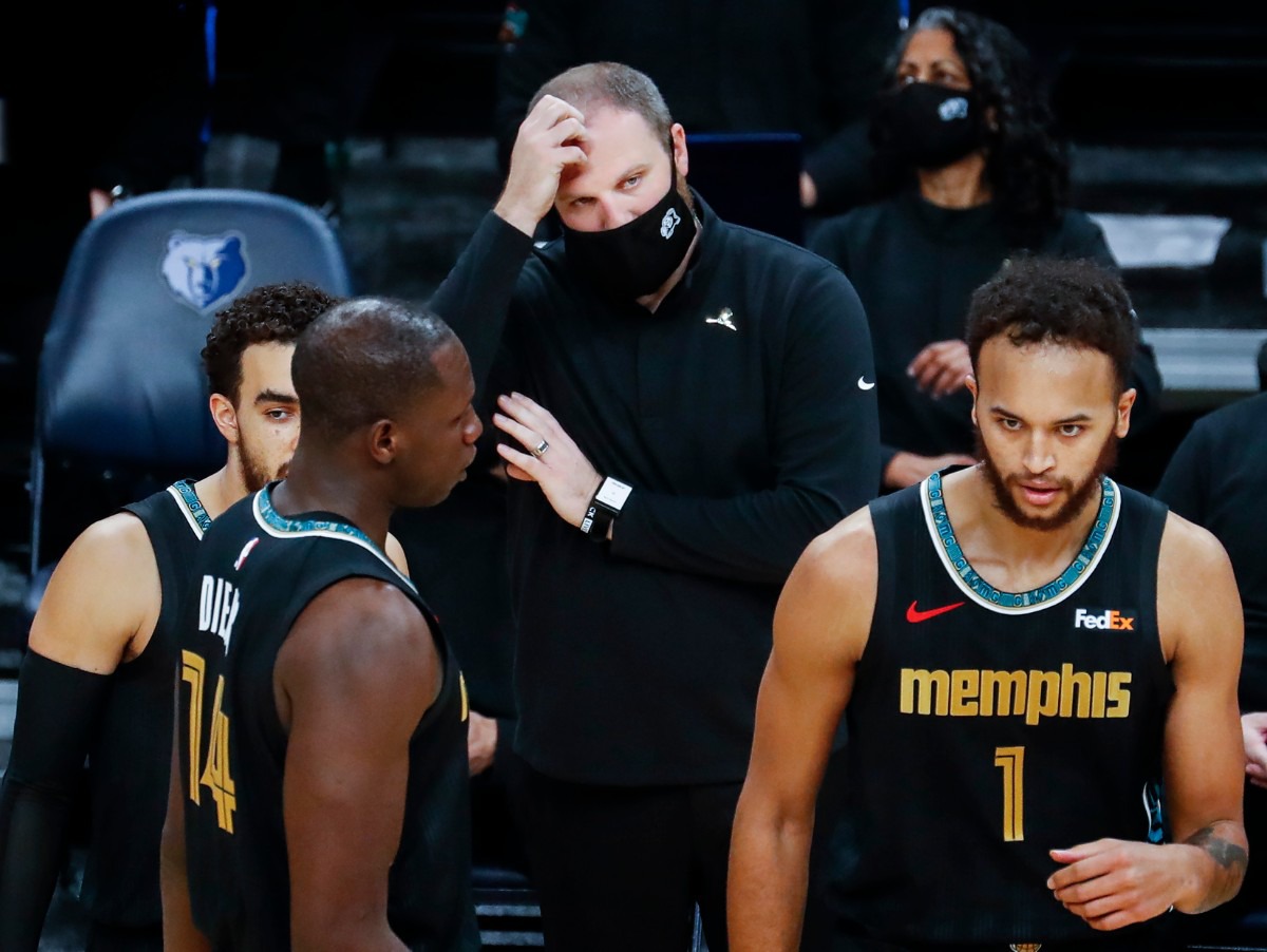 <strong>Memphis Grizzlies head coach Taylor Jenkins (middle) scratches his head during a break in action against the Phoenix Suns on Monday, Jan. 18, 2021.</strong> (Mark Weber/The Daily Memphian)