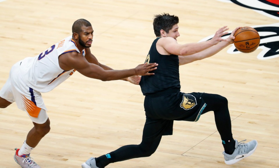 <strong>Memphis Grizzlies guard Grayson Allen (right) is fouled by Phoenix Suns defender Chris Paul (left) during action on Monday, Jan. 18, 2021.</strong> (Mark Weber/The Daily Memphian)