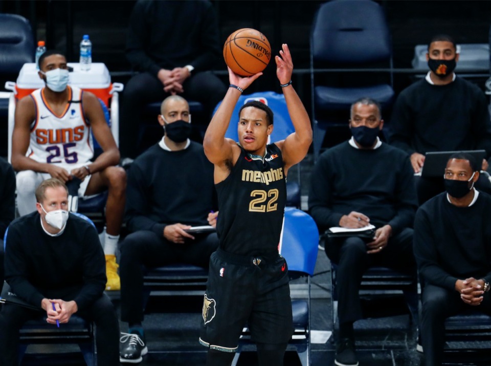<strong>Memphis Grizzlies guard Desmond Bane (middle) puts up a 3-point shot in front of the Phoenix Suns bench during action on Monday, January 18, 2021.</strong> (Mark Weber/The Daily Memphian)