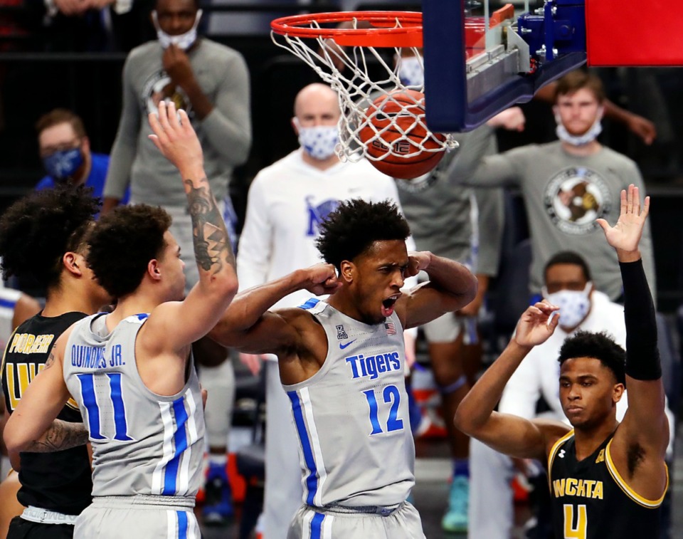 <strong>University of Memphis forward DeAndre Williams (12) flexes after a put-back layup during the Jan. 21, 2021, game against the Wichita State Shockers at FedExForum.</strong> (Patrick Lantrip/Daily Memphian)