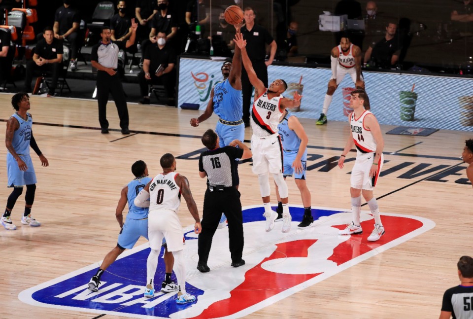 <strong>The Memphis Grizzlies faced the Portland Trail Blazers on July 31, 2020, in the NBA bubble in Lake Buena Vista, Fla</strong>. <strong>The Grizzlies&rsquo; two games in Portland were postponed due to COVID-19 contact tracing problems.</strong> (Mike Ehrmann/Associated Press file)
