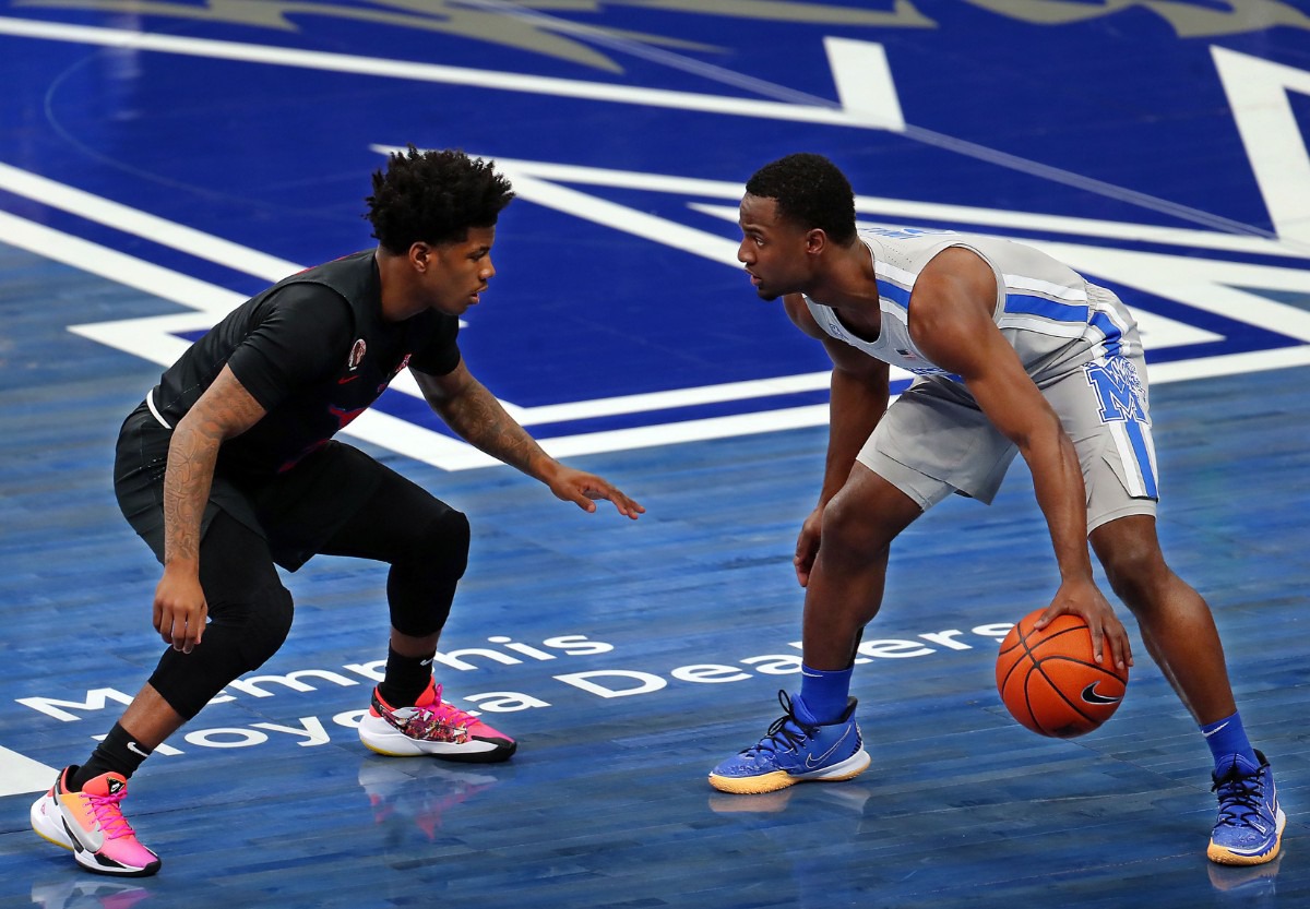 <strong>University of Memphis guard Alex Lomax (2) dribbles the ball while being defended by Southern Methodist University guard Kendric Davis (3) on Jan. 26, 2021, at FedExForum in Memphis, Tennessee.</strong> (Patrick Lantrip/Daily Memphian)