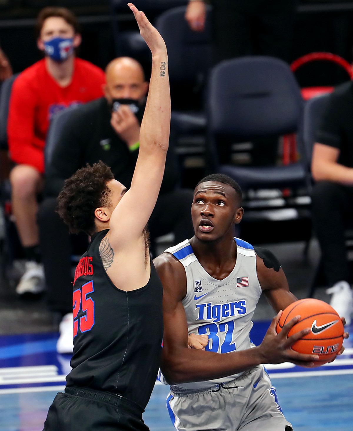 <strong>University of Memphis center Moussa Cisse (32) drives against Southern Methodist University forward Ethan Chargois (25) on Jan. 26, 2021, at FedExForum.</strong> (Patrick Lantrip/Daily Memphian)