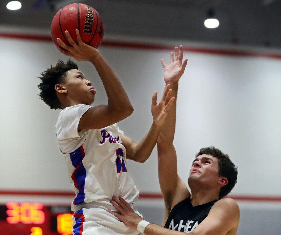 <strong>Bartlett guard J.R. Jacobs (11) goes up for a layup on Jan. 28 against MHEA.</strong> (Patrick Lantrip/Daily Memphian)