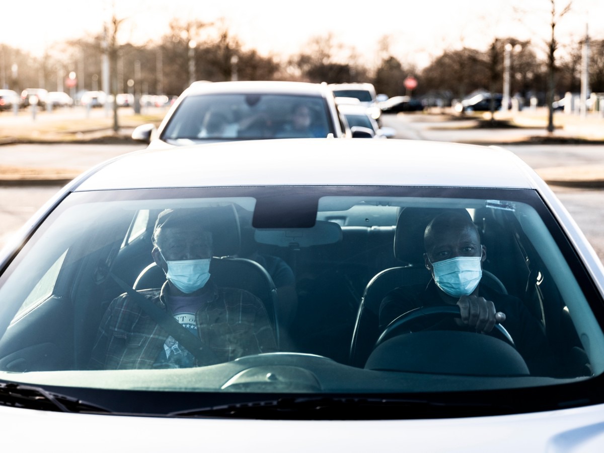 <strong>Tyrone Currie (right) drives his parents, James Thomas Currie (left) and Luvenia Currie, while waiting to receive their COVID-19 vaccine inside the Pipkin Building, Friday, Jan. 29, 2021.</strong> (Brad Vest/Special to The Daily Memphian)