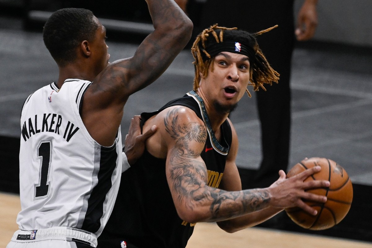 <strong>Memphis Grizzlies' Brandon Clarke (right) drives against San Antonio Spurs' Lonnie Walker IV during an NBA basketball game, Saturday, Jan. 30, 2021, in San Antonio.</strong> (Darren Abate/AP)