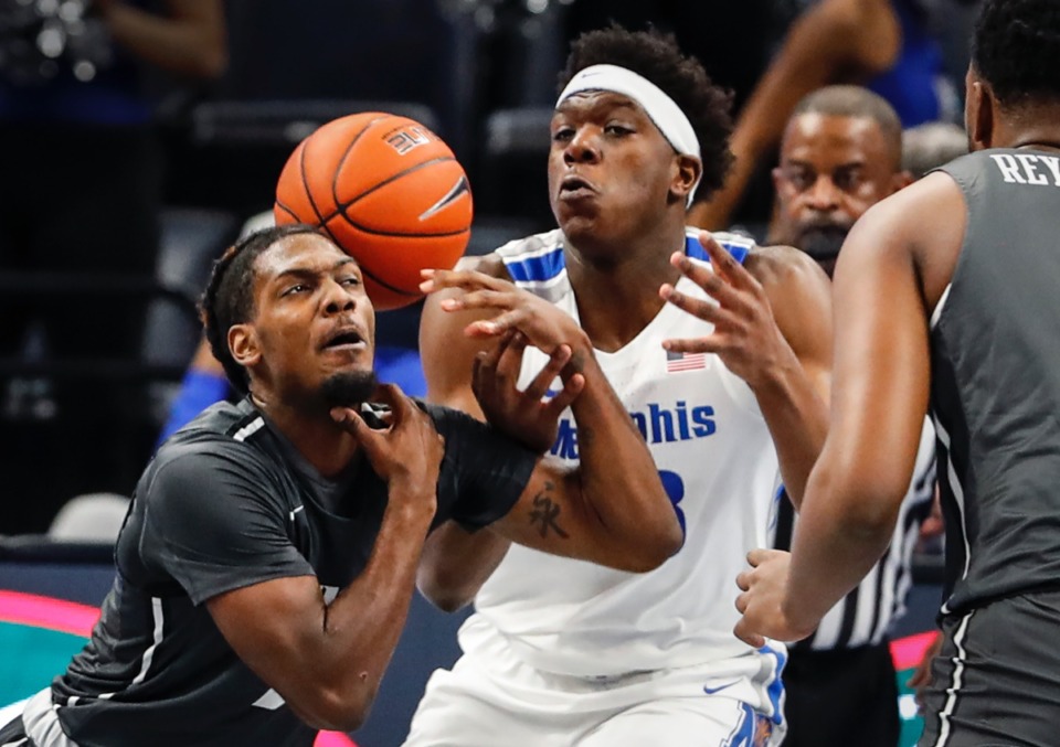 <strong>Tigers center Malcolm Dandridge (right) battles UCF defender Darius Perry (left) for a rebound.</strong> (Mark Weber/The Daily Memphian)