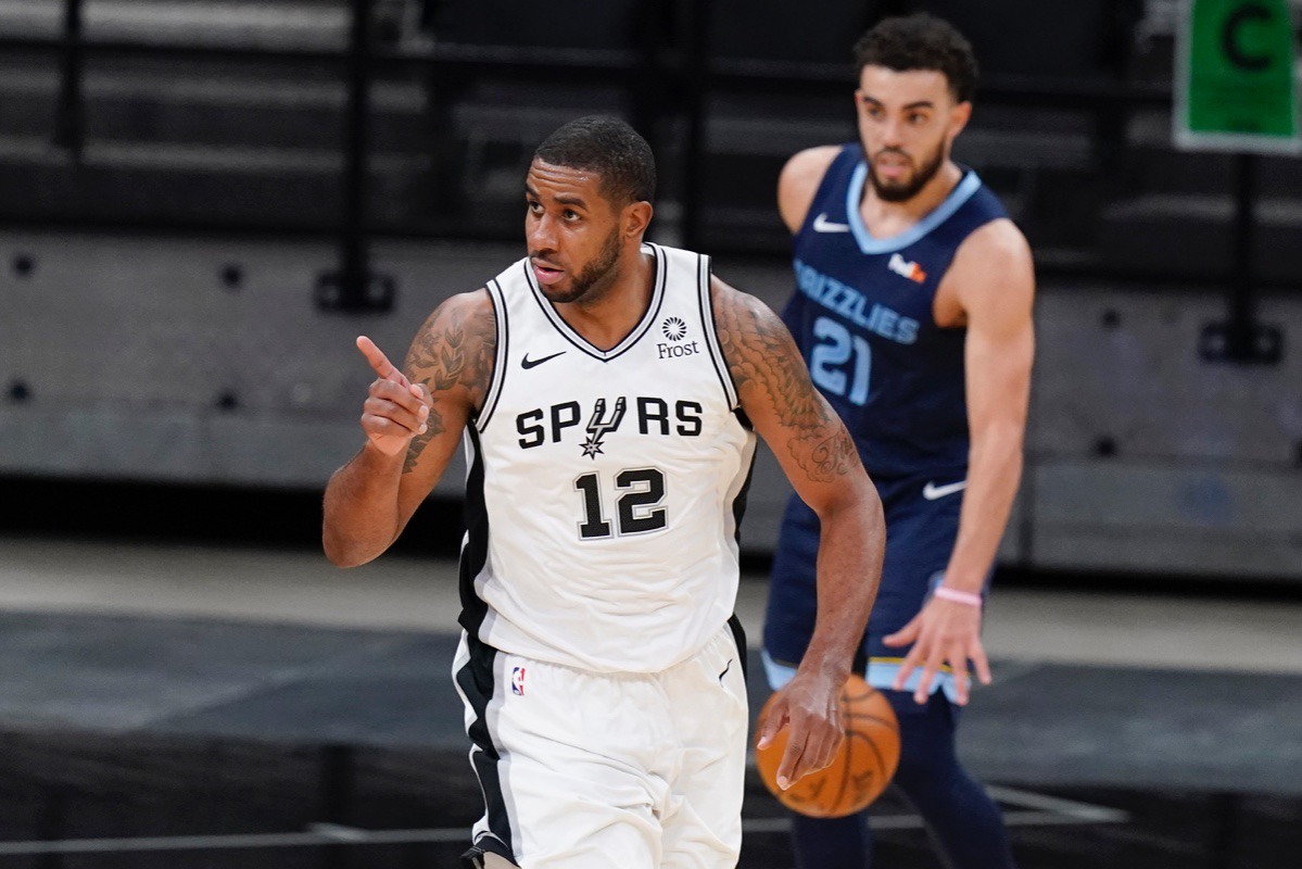 <strong>San Antonio Spurs center LaMarcus Aldridge (12) reacts after scoring against the Memphis Grizzlies on Monday, Feb. 1, 2021.</strong> (Eric Gay/AP