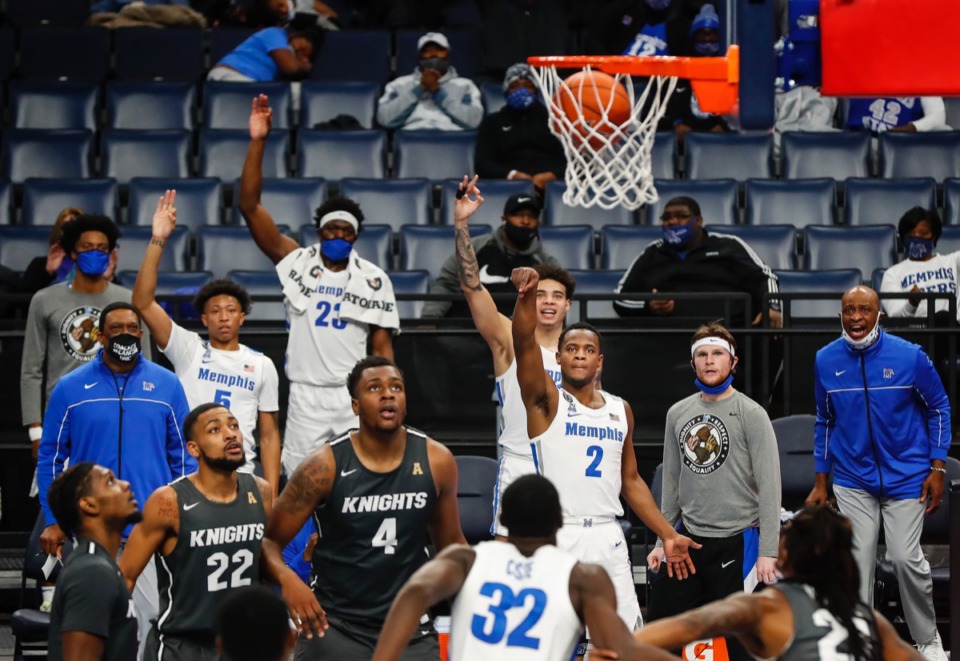 <strong>The Tigers&rsquo; bench celebrates a 3-point basket by teammate Alex Lomax (middle) against UCF on Monday, Feb. 1, 2021.</strong> (Mark Weber/The Daily Memphian)