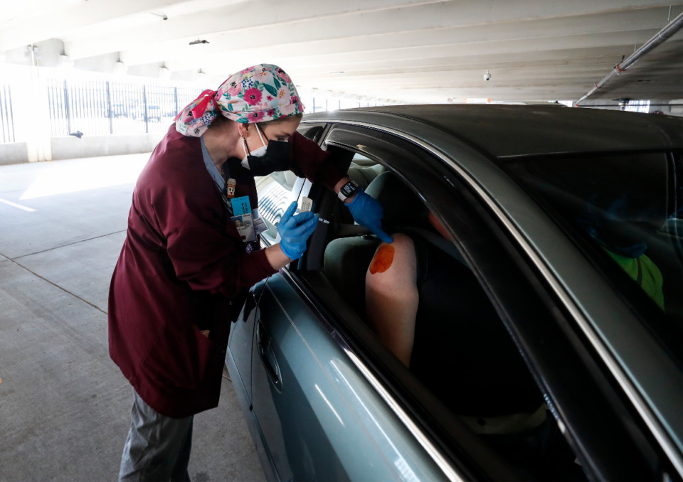 <strong>Memphis VA Medical Center personnel provide COVID-19 vaccinations to veterans on Tuesday, Jan. 26, 2021 in the hospital parking lot.</strong> (Mark Weber/The Daily Memphian)