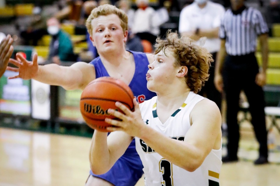 <strong>Briarcrest guard Tyler Harrington (front) drives the lane in front of MUS defender Jack Jabbour (back) on Tuesday, Feb. 2, 2021.</strong> (Mark Weber/The Daily Memphian)