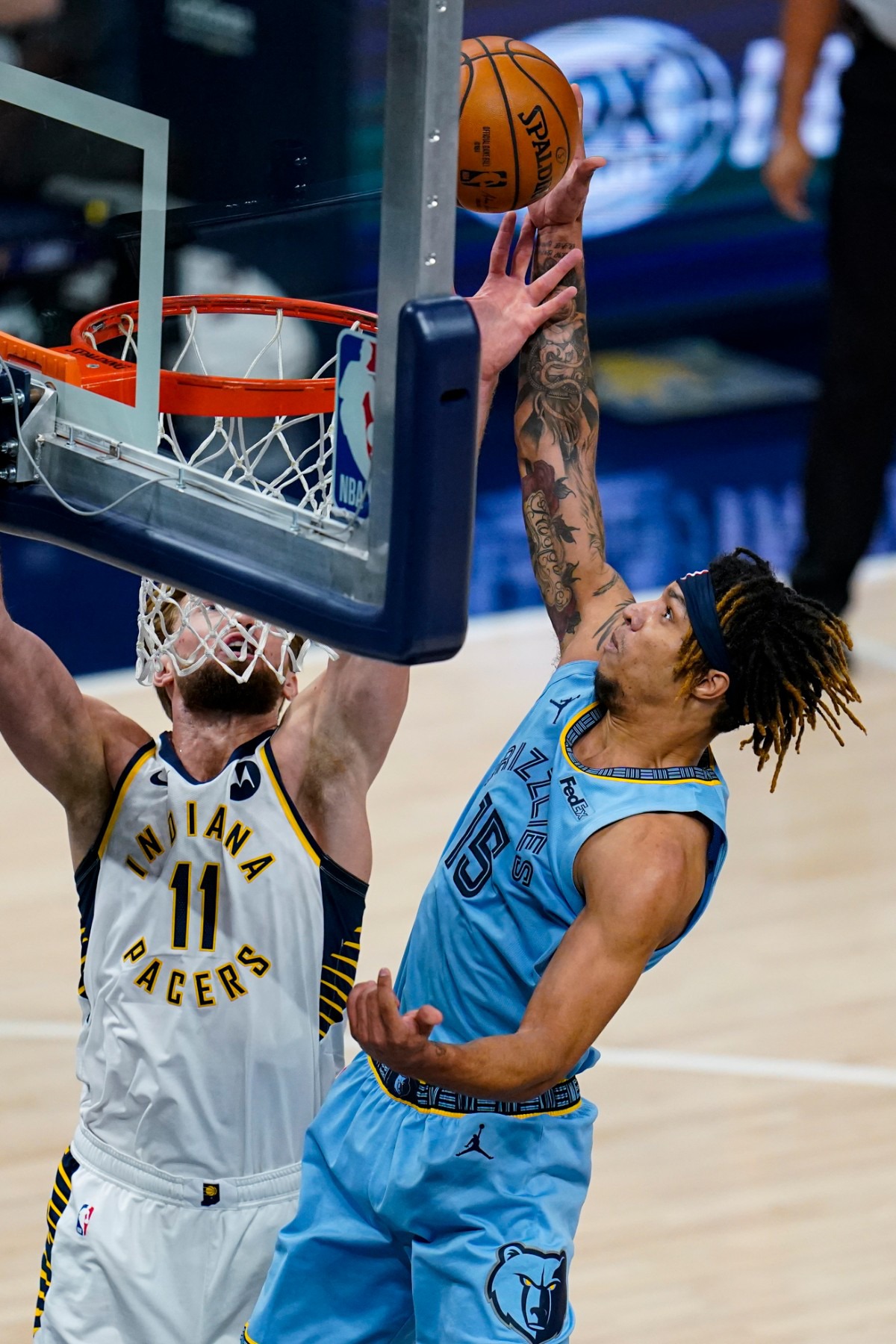 <strong>Memphis Grizzlies forward Brandon Clarke (15) gets a tip-in over Indiana Pacers forward Domantas Sabonis (11) in Indianapolis on Tuesday, Feb. 2, 2021.</strong> (Michael Conroy/AP)