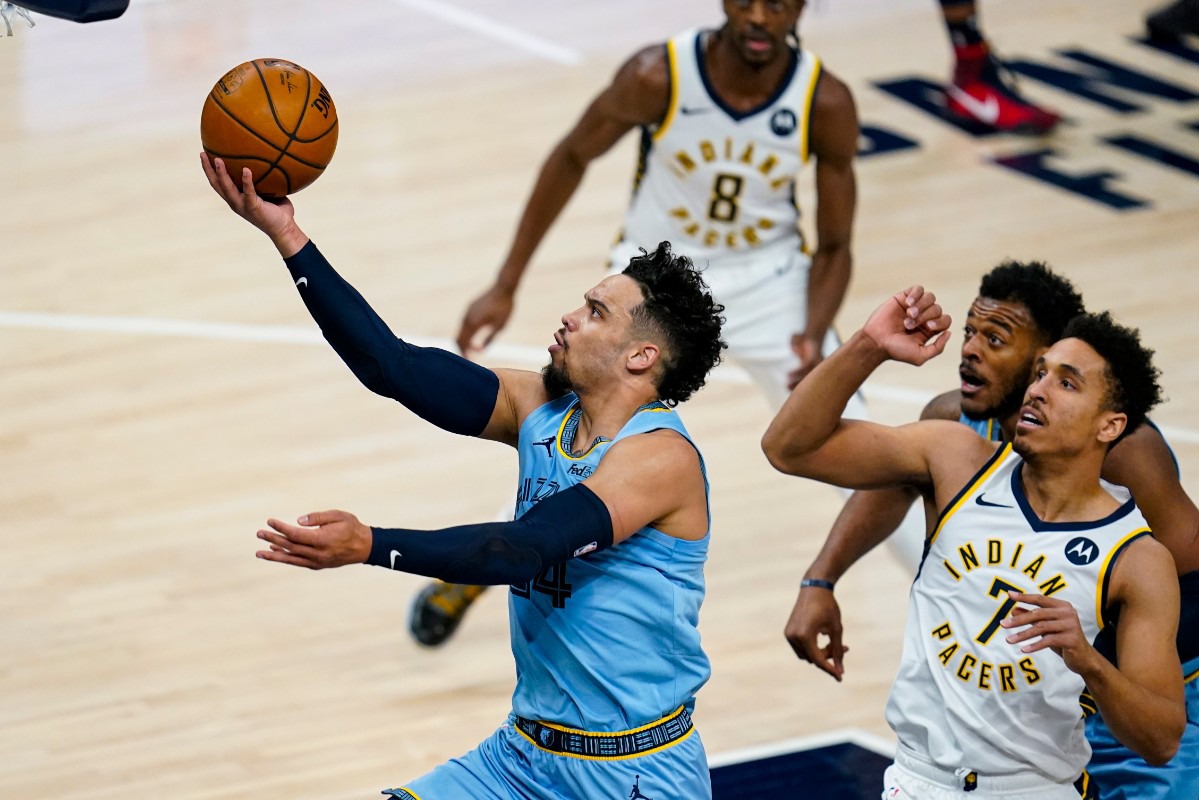 <strong>Memphis Grizzlies guard Dillon Brooks (24) shoots in front of Indiana Pacers guard Malcolm Brogdon (7) on Tuesday, Feb. 2, 2021, in Indianapolis.</strong> (Michael Conroy/AP)